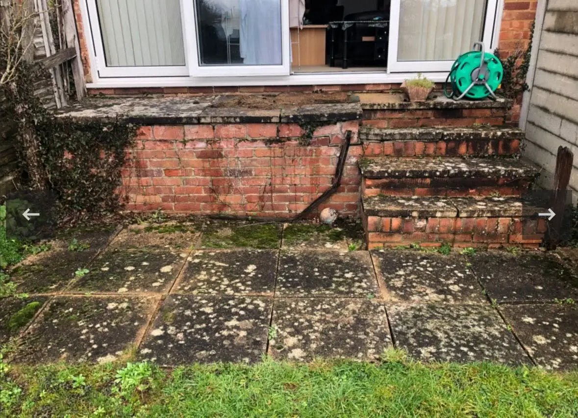 Old, mossy patio and concrete steps before the rebuild