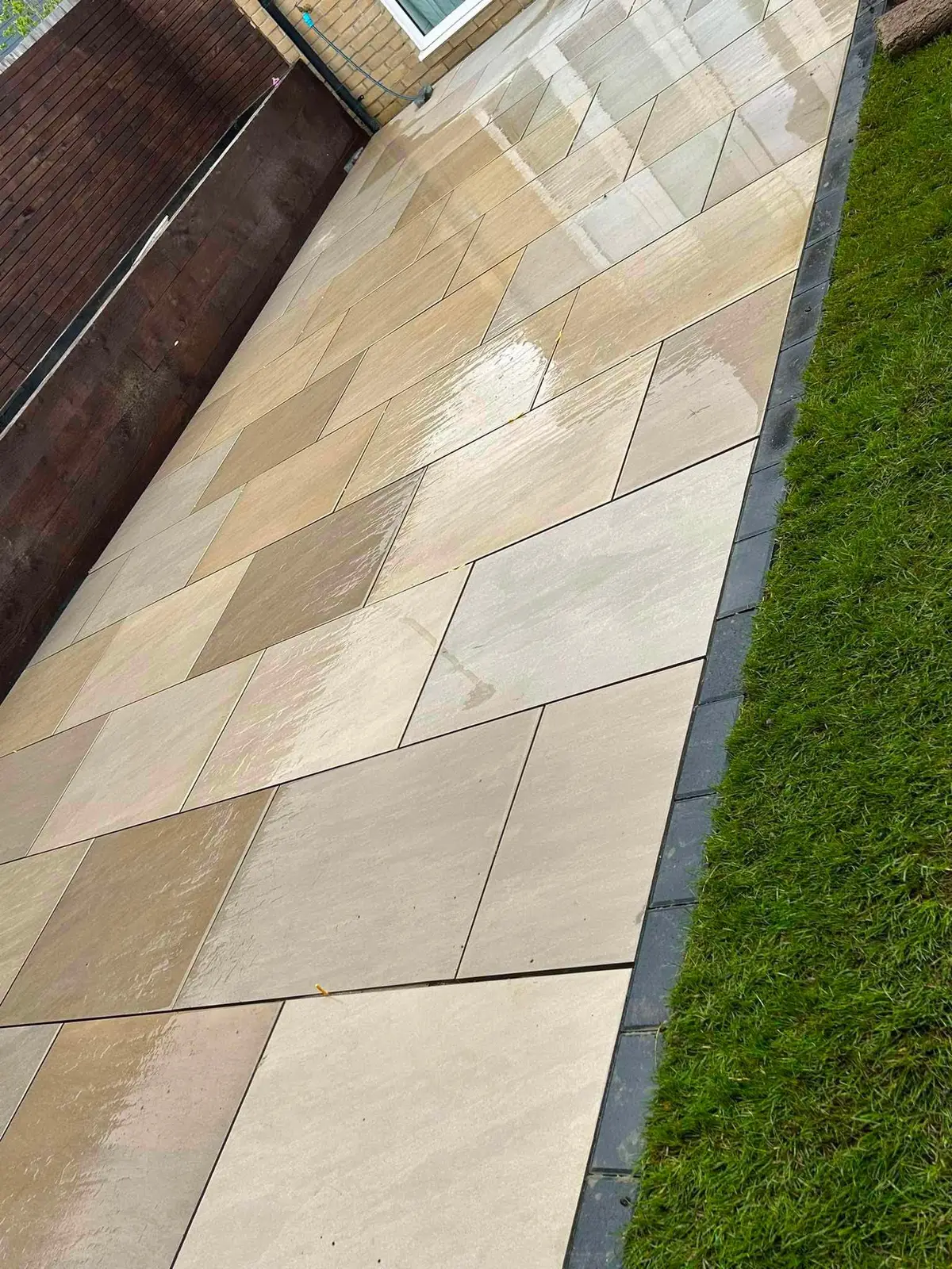 Finished sandstone patio installed by Boss Landscape Gardening in Milton Keynes